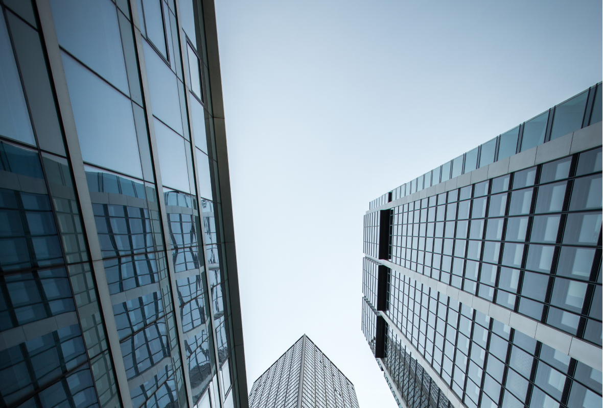 vertical-low-angle-shot-high-rise-skyscrapers-glass-facade-frankfurt-germany-1